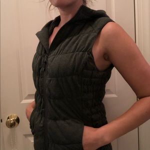 Puffy army green vest with a hood